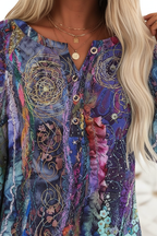 Close-up neckline detail of purple abstract floral tunic