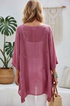 Editorial back view of see-through mauve tunic
