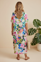 Editorial back view of vibrant multicolour abstract floral maxi dress