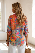Editorial back view upper body of vibrant floral patchwork shirt