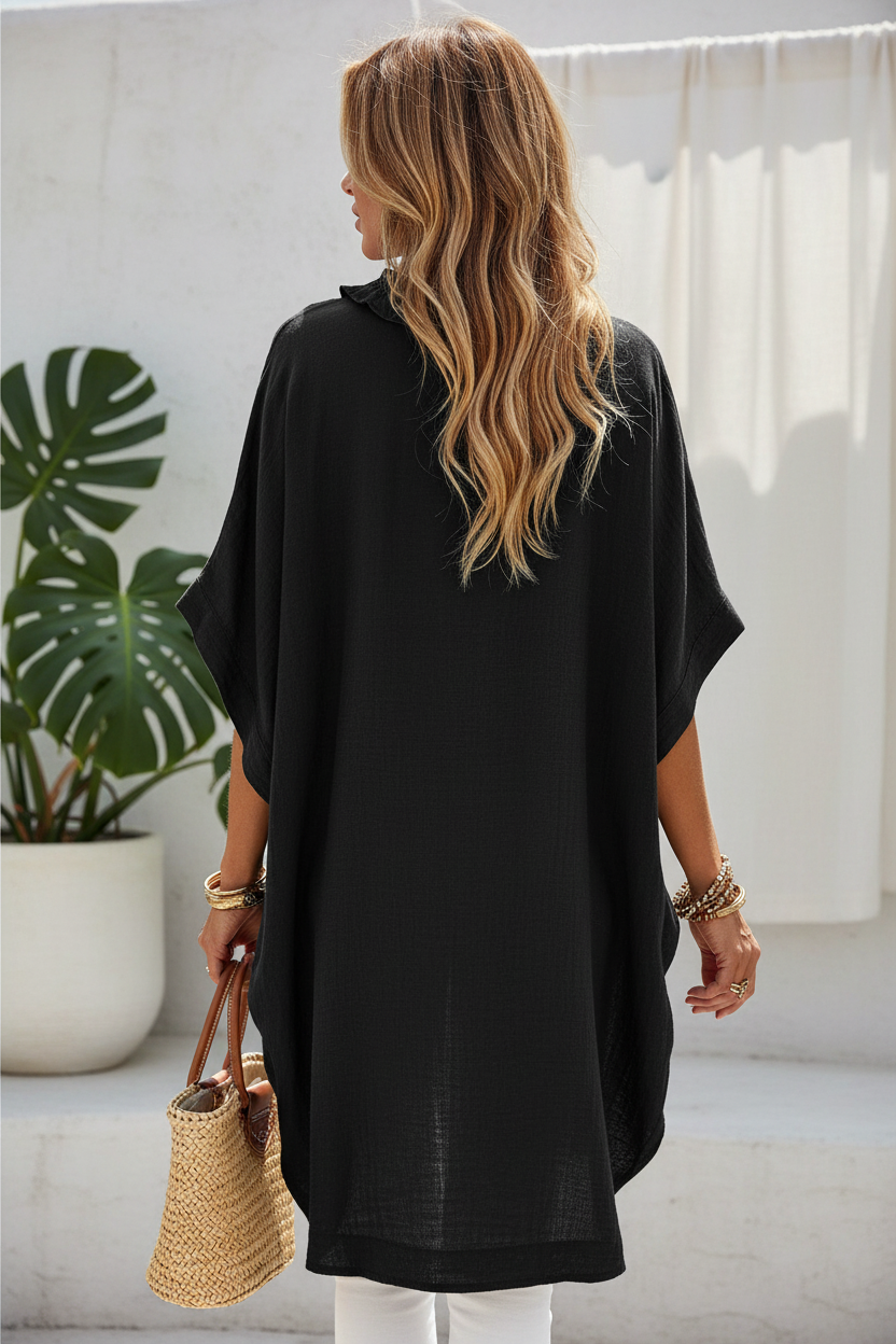 Editorial back view upper body shot of black tunic