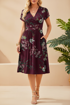 Editorial front view of burgundy floral wrap dress