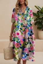 Editorial front view of vibrant multicolour abstract floral maxi dress