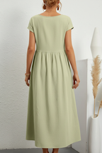 Model back view wearing sage green maxi dress
