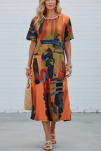S141 abstract print dress - front view white brick